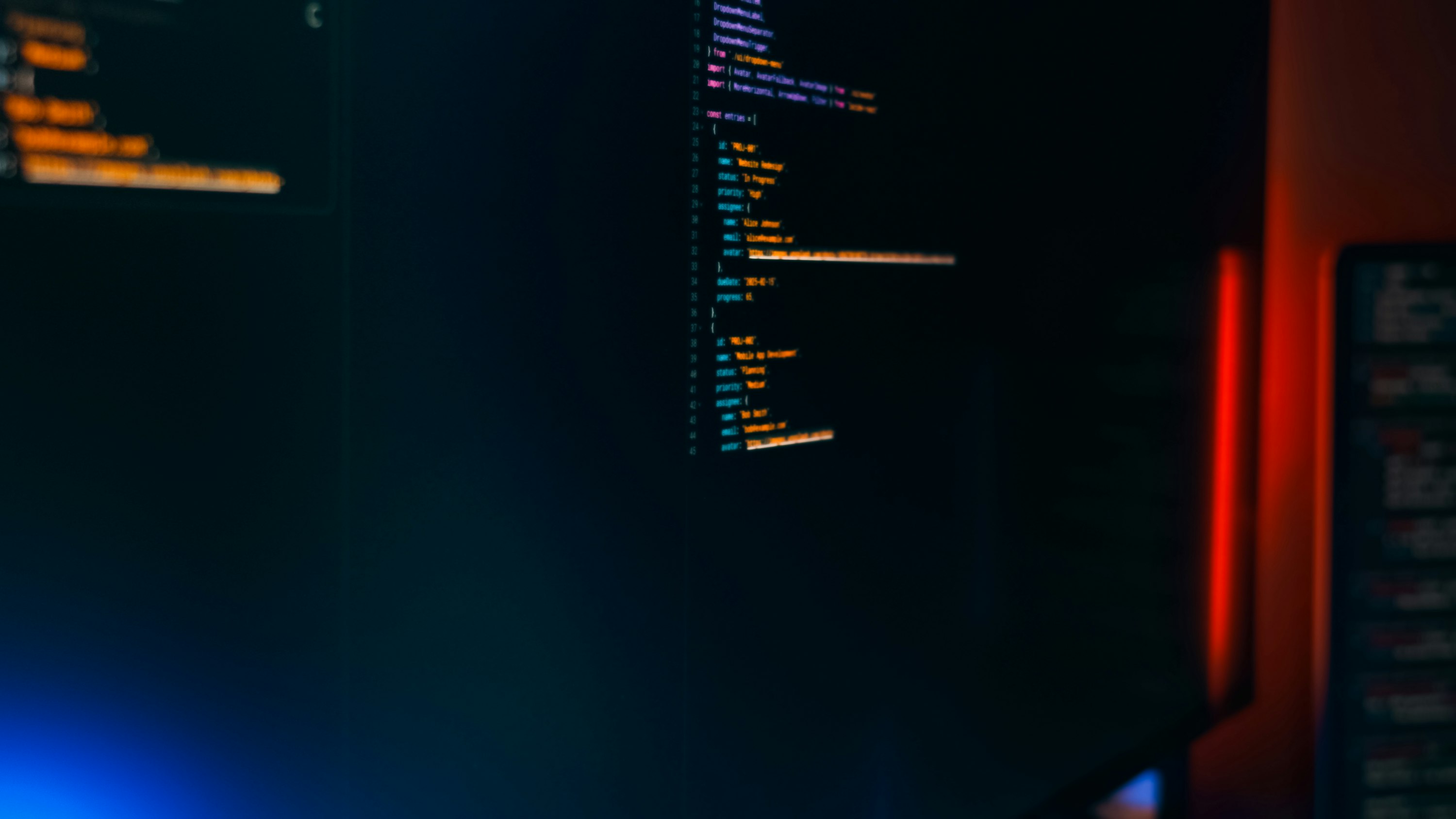 Syntax-highlighted code on a dark monitor — nix-darwin modules managing macOS system state